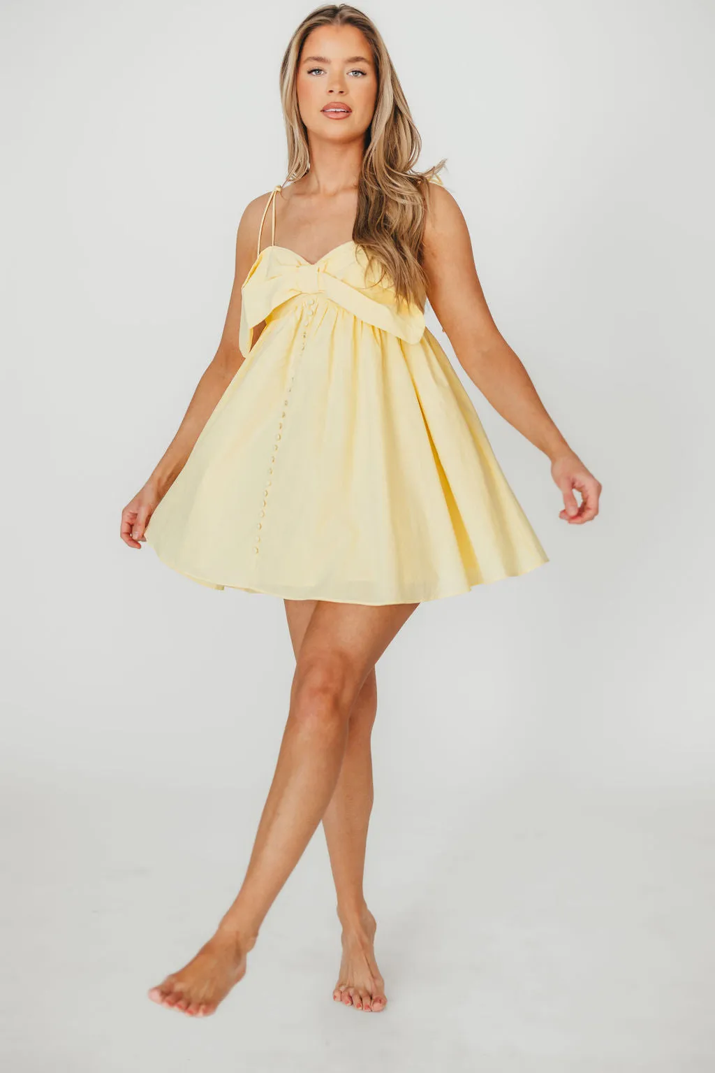 Irelyn Babydoll Mini Dress with Bow Accent in Yellow